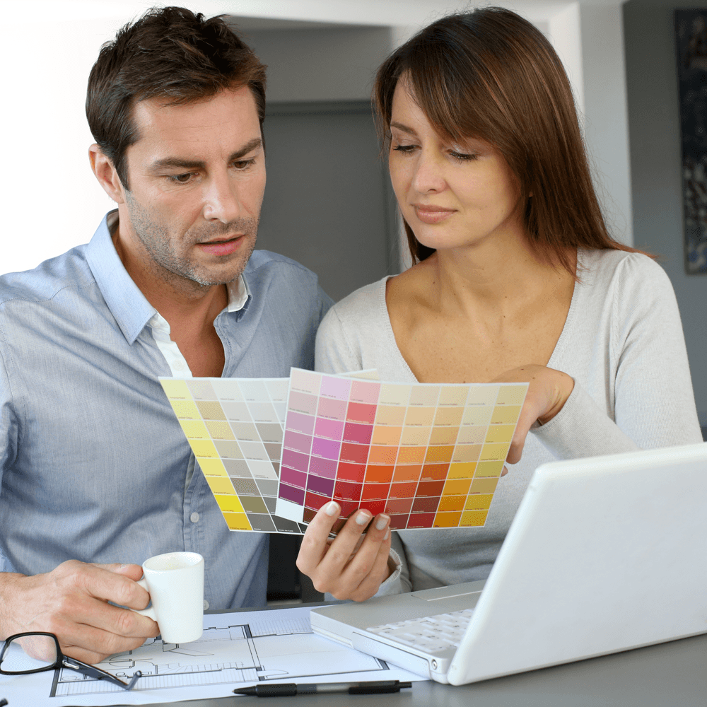 best-things-about-building-new-home-couple-choosing-paint-colours.png