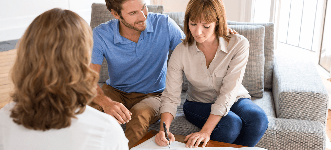 tips-making-your-home-buying-process-easier-couple-signing-contract.png