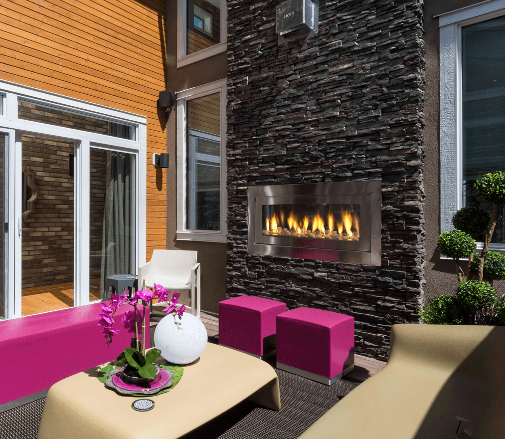 Top 10 Outdoor Living Features for Your Home Hugo Courtyard Fireplace image